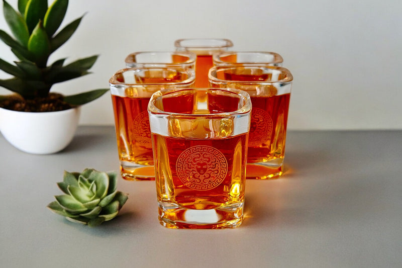 Branded Medusa! Introducing our Exquisite Set of Six Shot Glasses, exuding the Opulent Elegance Reminiscent of Versace. Crafted with meticulous attention to detail, each glass radiates beauty and sophistication. Perfect for savoring tequila or vodka.