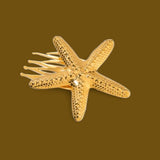 Sun-Kissed Starfish Hair Pin: A golden touch of coastal charm.