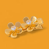 The Golden Duo Hair Pin: Two sparkling blooms for your hair.