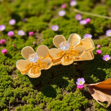 The Golden Duo Hair Pin: Two sparkling blooms for your hair.