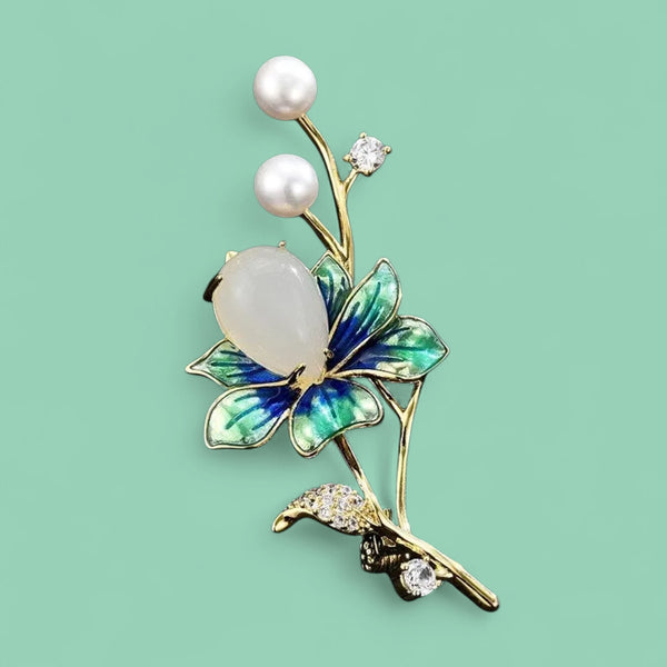 The Midnight Bloom Brooch: Enameled elegance with a pearl heart.